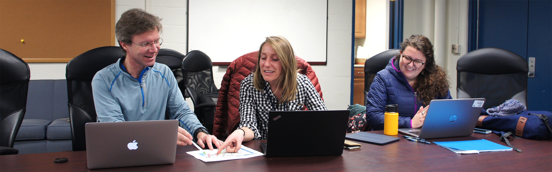 students and faculty member doing Field research