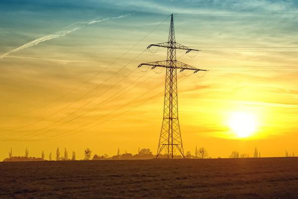 Power lines and the setting sun