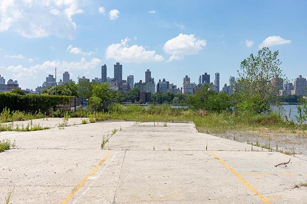 A vacant lot in Queens sits across the East River from Manhattan, New York