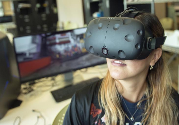 Doctoral student Debora Verniz uses a virtual-reality headset to ""visit" the favela Santa Marta in Rio de Janeiro, Brazil.