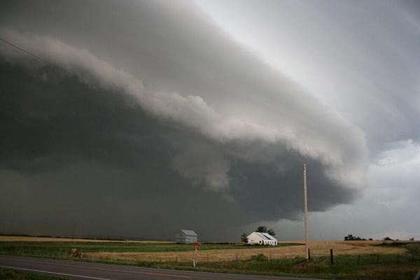 Storm clouds moving over farm fields 