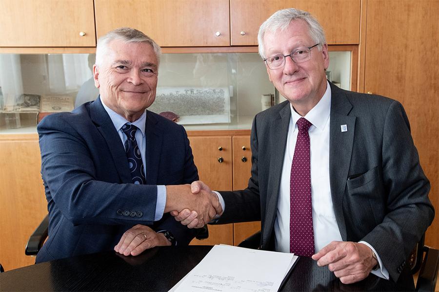 Penn State President Eric Barron, left, and University of Freiburg Rector Hans-Jochen Schiewer