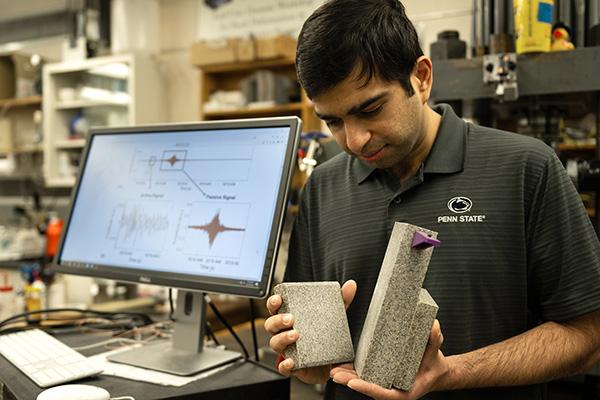 First author Prabhav Borate, a graduate student in engineering science, demonstrates how lab earthquakes are created: by grinding two blocks of rock together until a failure occurs.